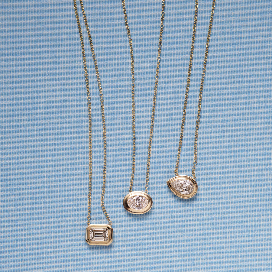 The RADIATE SLIDER - EMERALD CUT by East London jeweller Rachel Boston | Discover our collections of unique and timeless engagement rings, wedding rings, and modern fine jewellery. - Rachel Boston Jewellery