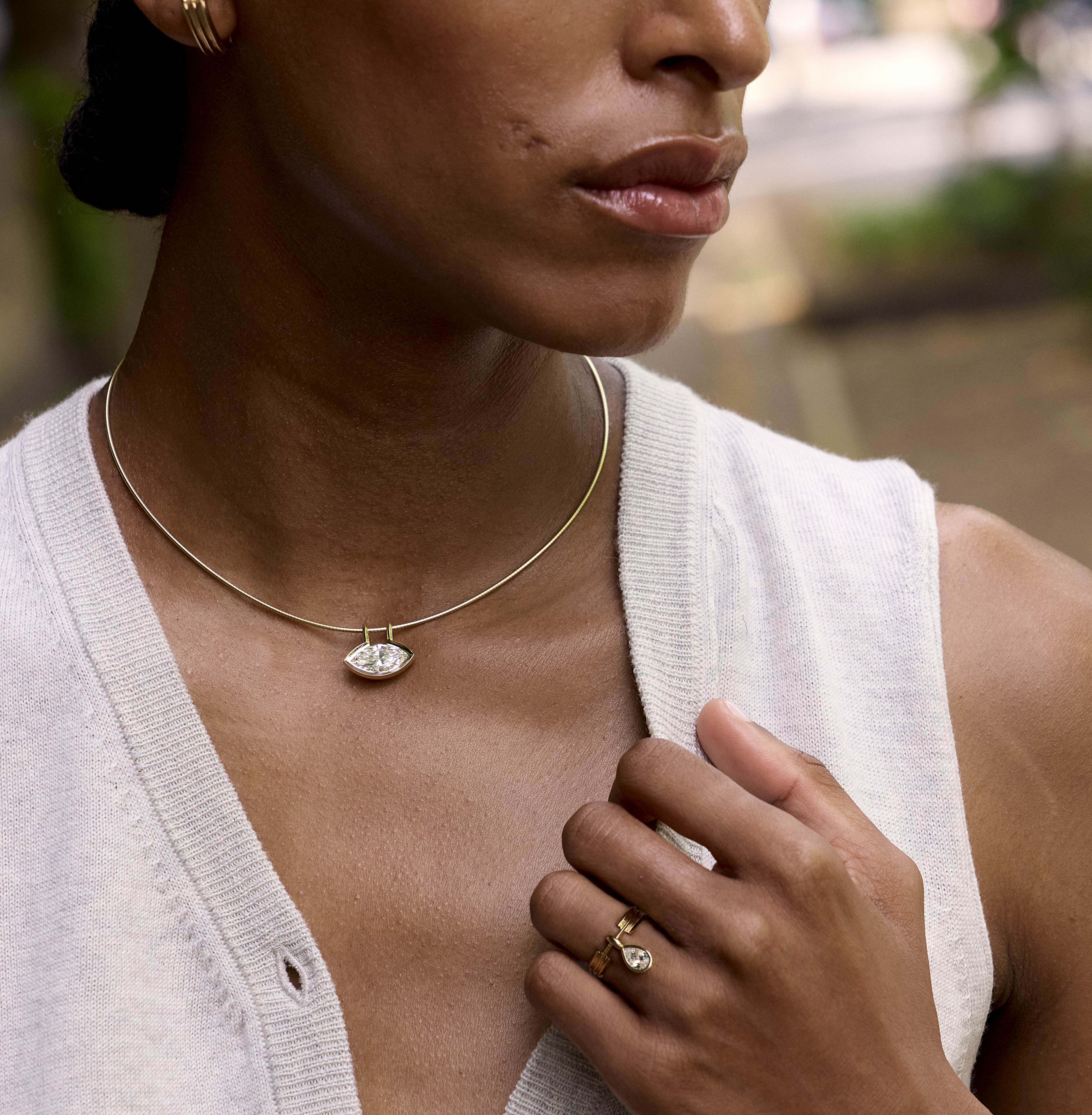 The Orbit Ring by East London jeweller Rachel Boston | Discover our collections of unique and timeless engagement rings, wedding rings, and modern fine jewellery.