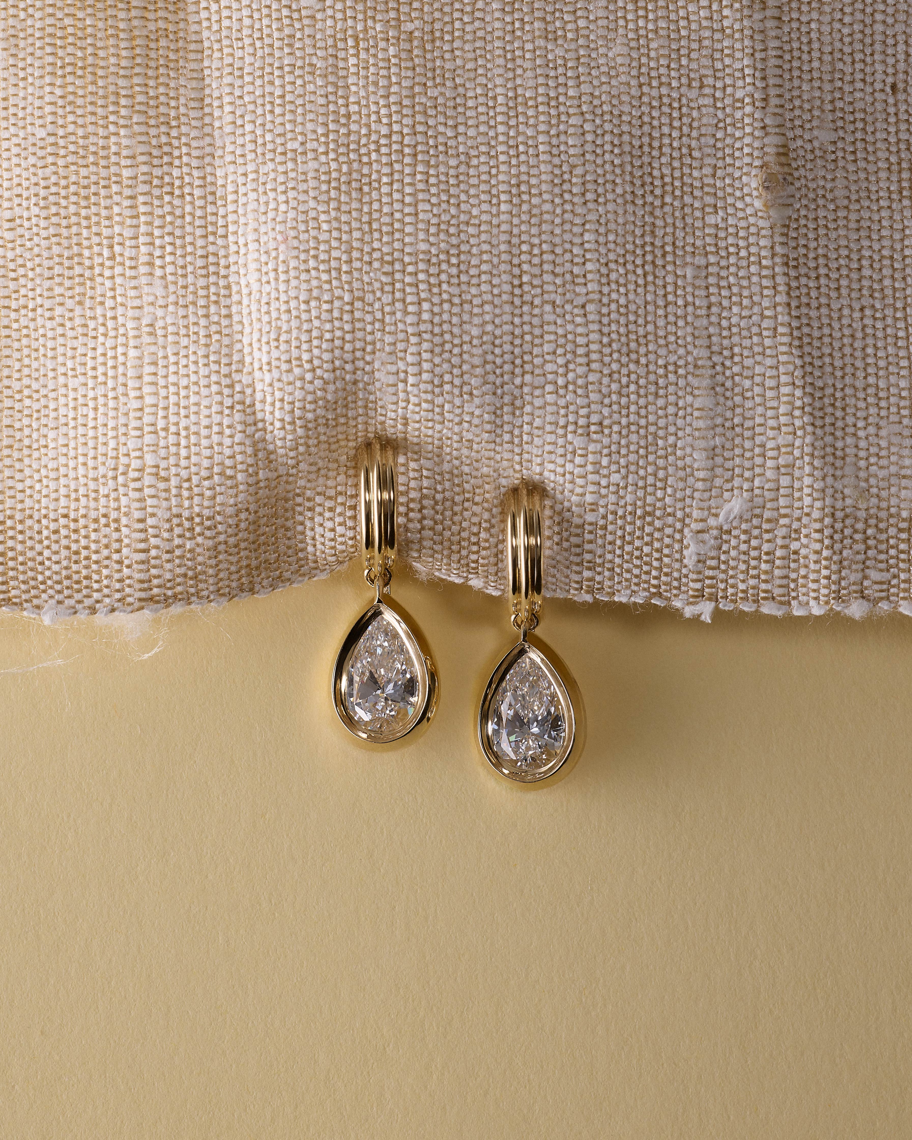 The Echo Earrings - Pear Cut by East London jeweller Rachel Boston | Discover our collections of unique and timeless engagement rings, wedding rings, and modern fine jewellery.
