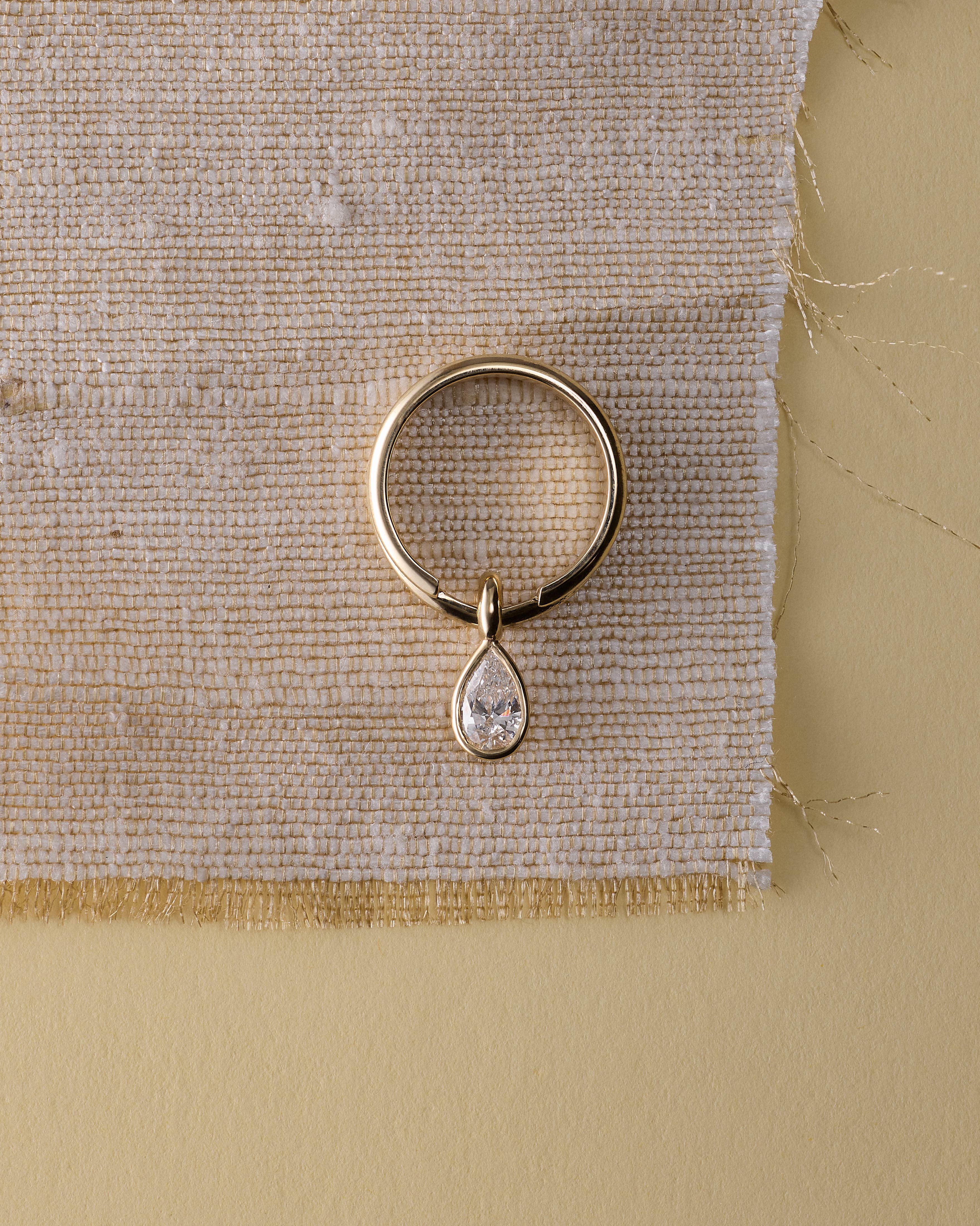 The Orbit Ring by East London jeweller Rachel Boston | Discover our collections of unique and timeless engagement rings, wedding rings, and modern fine jewellery.