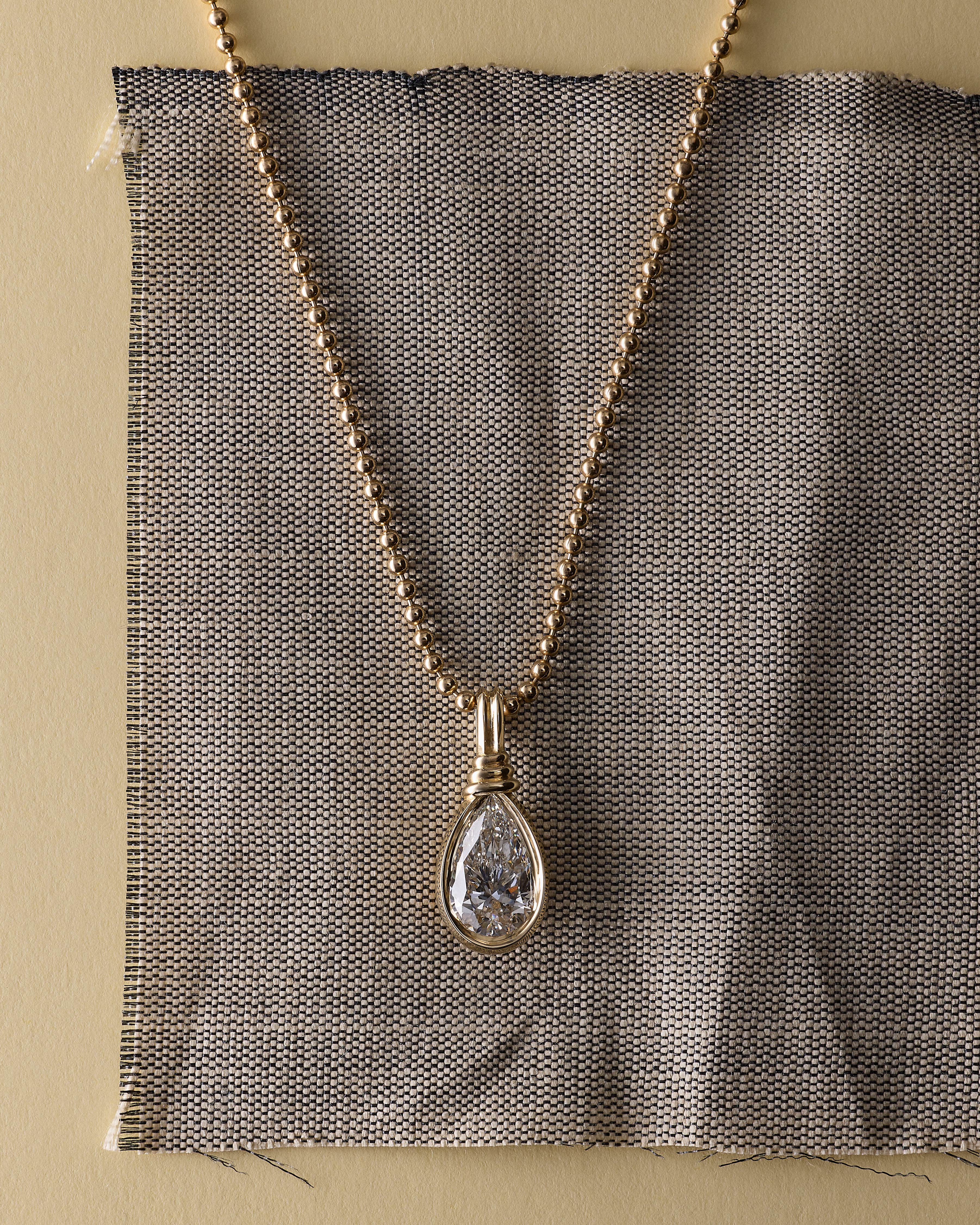 The Bound Pendant - Pear Cut by East London jeweller Rachel Boston | Discover our collections of unique and timeless engagement rings, wedding rings, and modern fine jewellery.