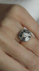 The Grey Halo Engagement Ring by East London jeweller Rachel Boston | Discover our collections of unique and timeless engagement rings, wedding rings, and modern fine jewellery.