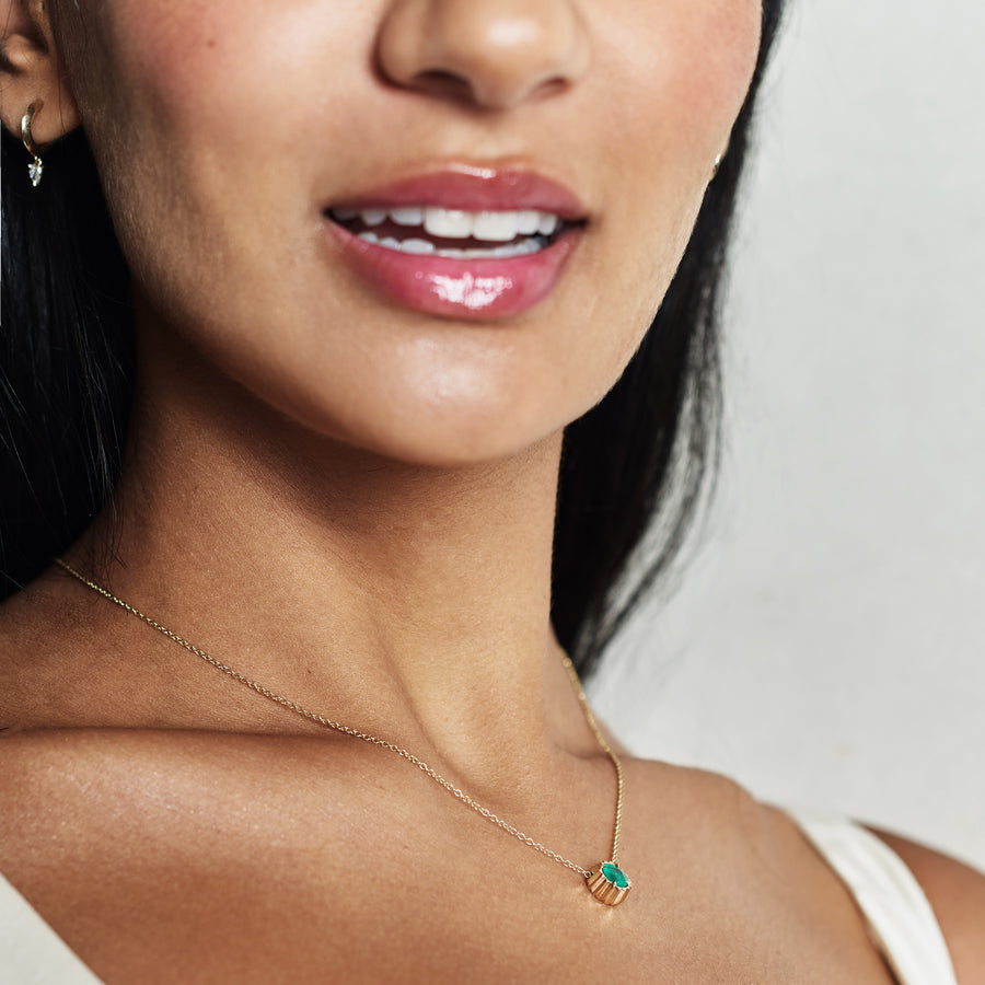 The X - Sunburst Emerald Necklace by East London jeweller Rachel Boston | Discover our collections of unique and timeless engagement rings, wedding rings, and modern fine jewellery. - Rachel Boston Jewellery