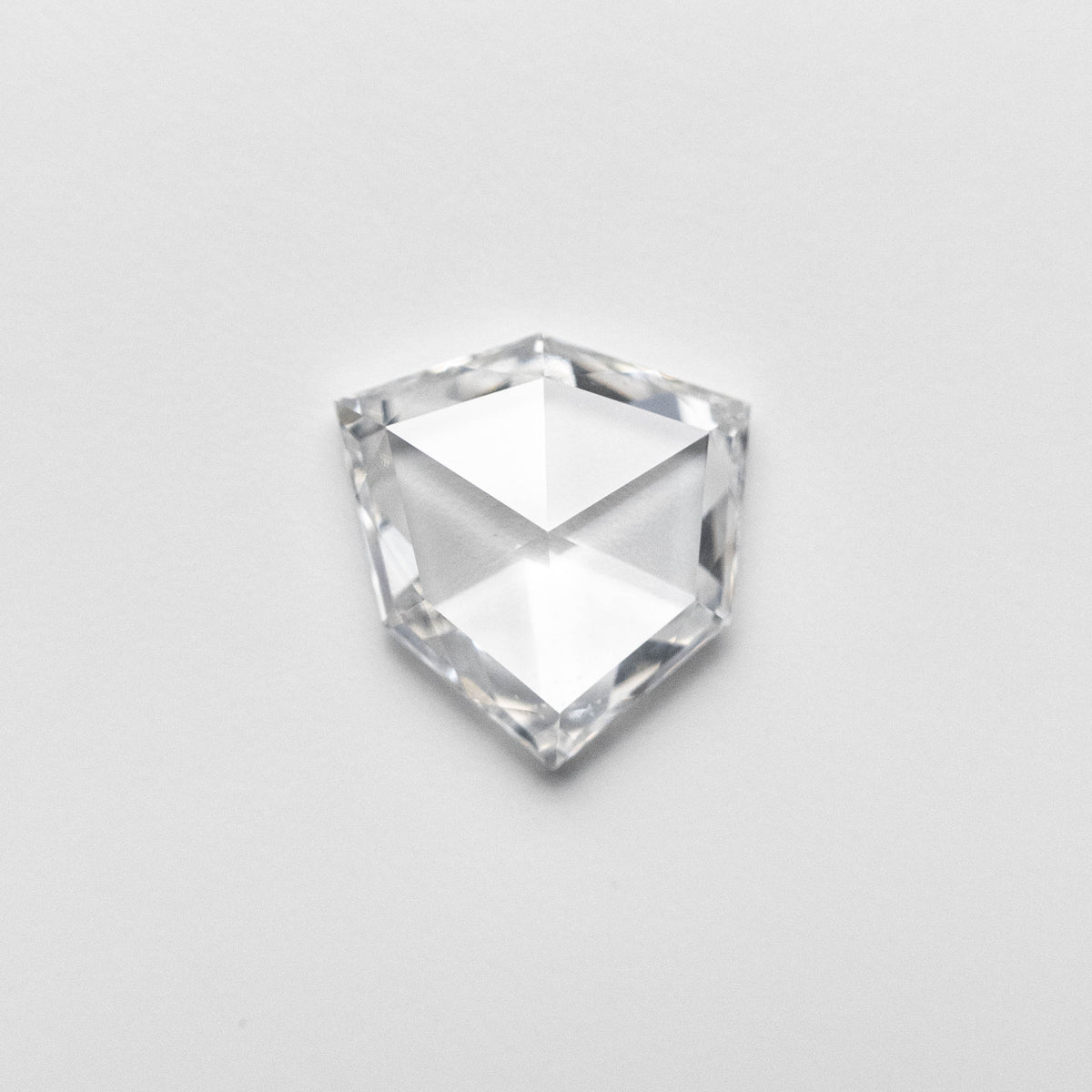 The 0.57ct 6.71x6.36x1.73mm Shield Rosecut 18496-04 by East London jeweller Rachel Boston | Discover our collections of unique and timeless engagement rings, wedding rings, and modern fine jewellery.