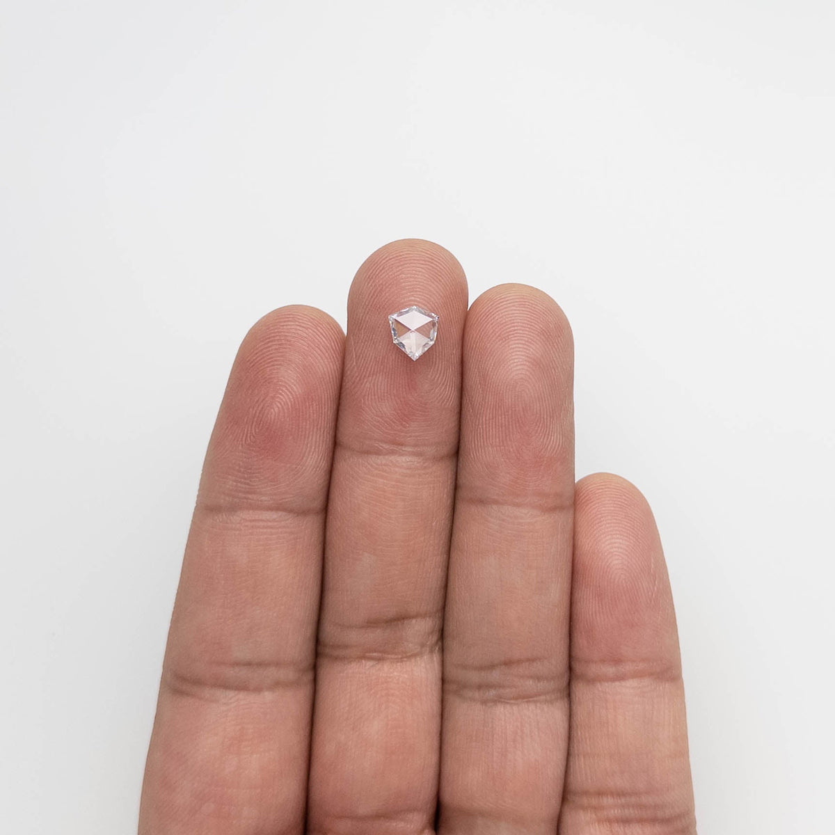 The 0.57ct 6.71x6.36x1.73mm Shield Rosecut 18496-04 by East London jeweller Rachel Boston | Discover our collections of unique and timeless engagement rings, wedding rings, and modern fine jewellery.