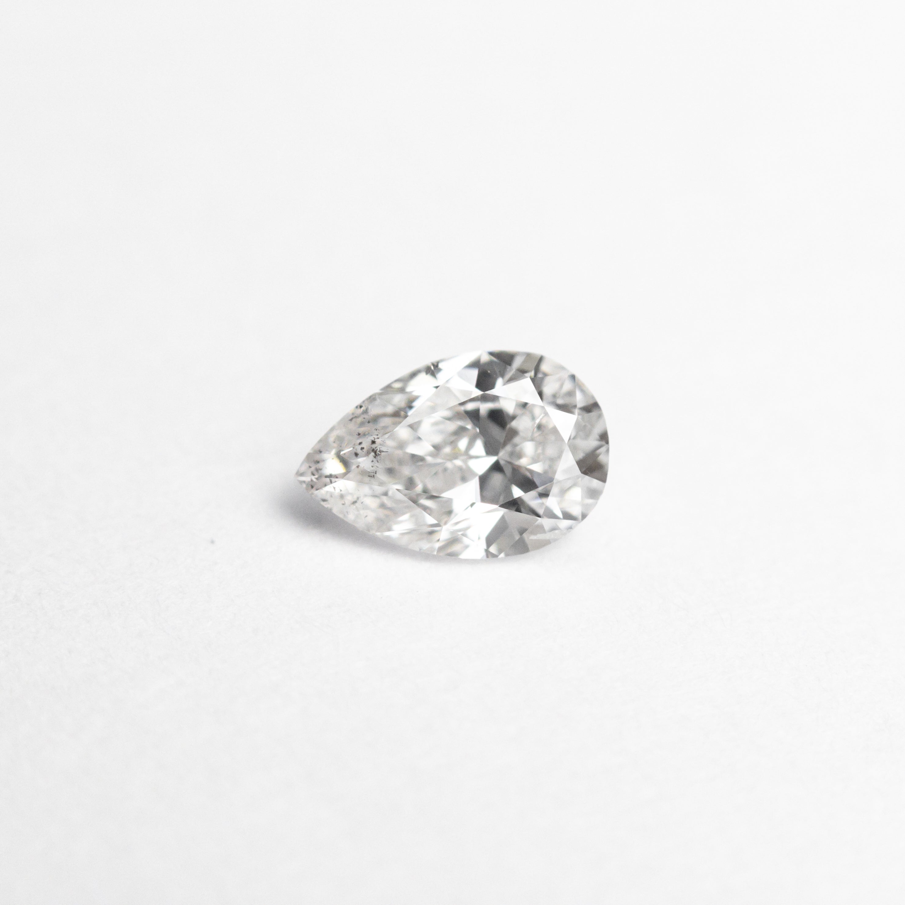 The 0.30ct 5.58x3.66x2.33mm SI2 E Pear Brilliant 19438-24 by East London jeweller Rachel Boston | Discover our collections of unique and timeless engagement rings, wedding rings, and modern fine jewellery.