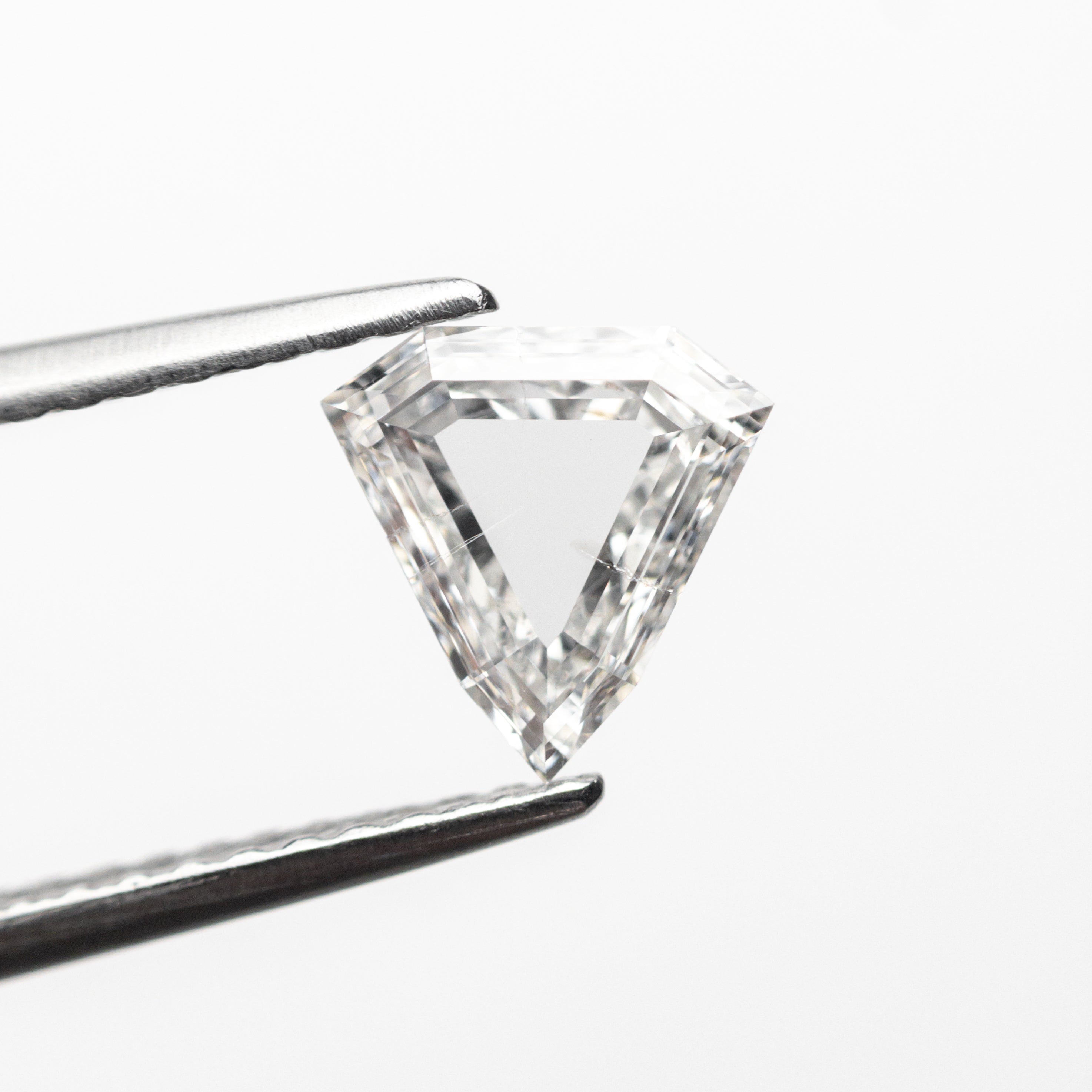 The 0.70ct 6.63x6.61x2.06mm SI2 F Shield Portrait Cut 19438-29 by East London jeweller Rachel Boston | Discover our collections of unique and timeless engagement rings, wedding rings, and modern fine jewellery.