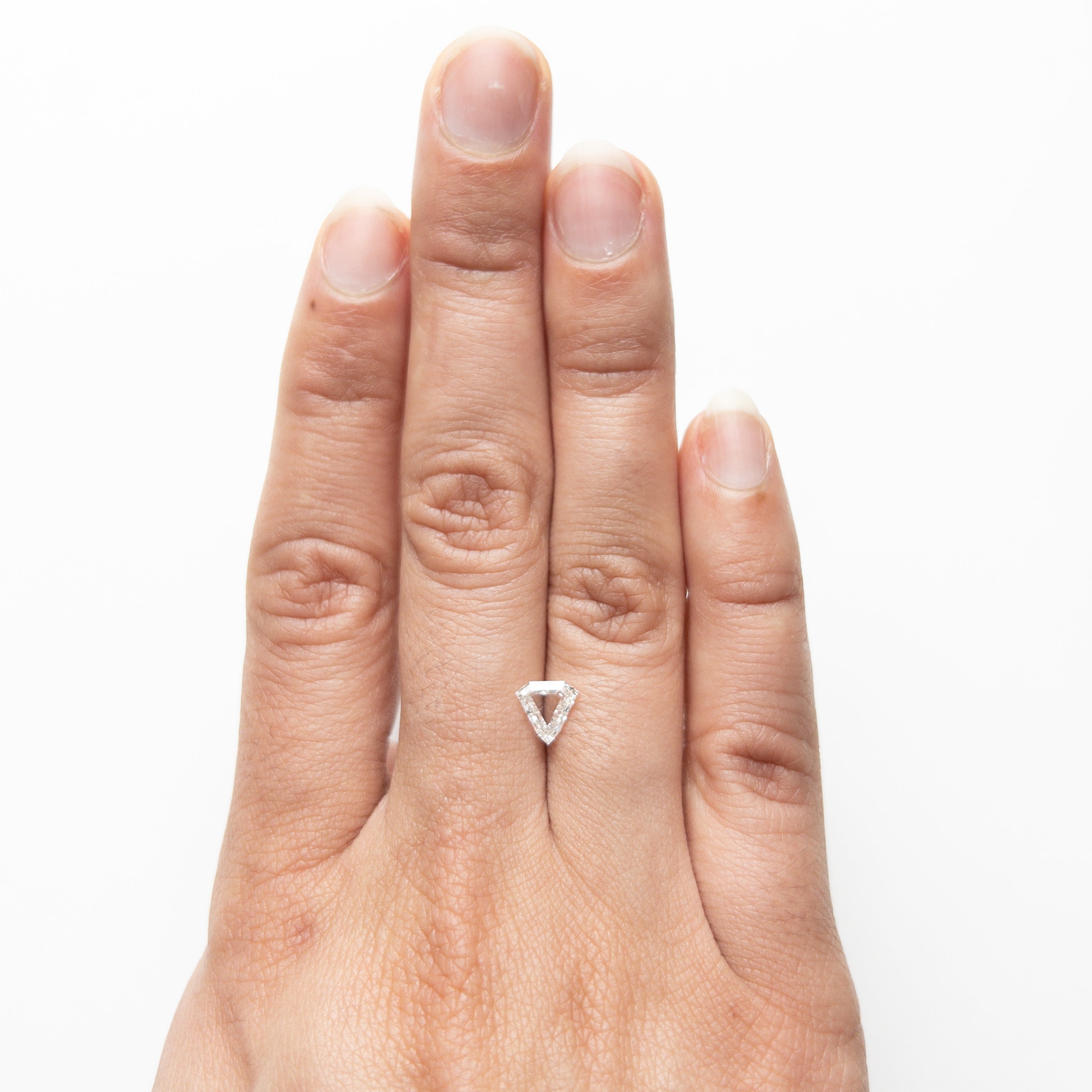 The 0.70ct 6.63x6.61x2.06mm SI2 F Shield Portrait Cut 19438-29 by East London jeweller Rachel Boston | Discover our collections of unique and timeless engagement rings, wedding rings, and modern fine jewellery.