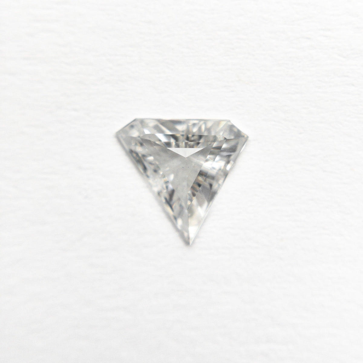 The 0.42ct 6.40x6.80x2.14mm SI2 F Shield Step Cut 19677-01 by East London jeweller Rachel Boston | Discover our collections of unique and timeless engagement rings, wedding rings, and modern fine jewellery.
