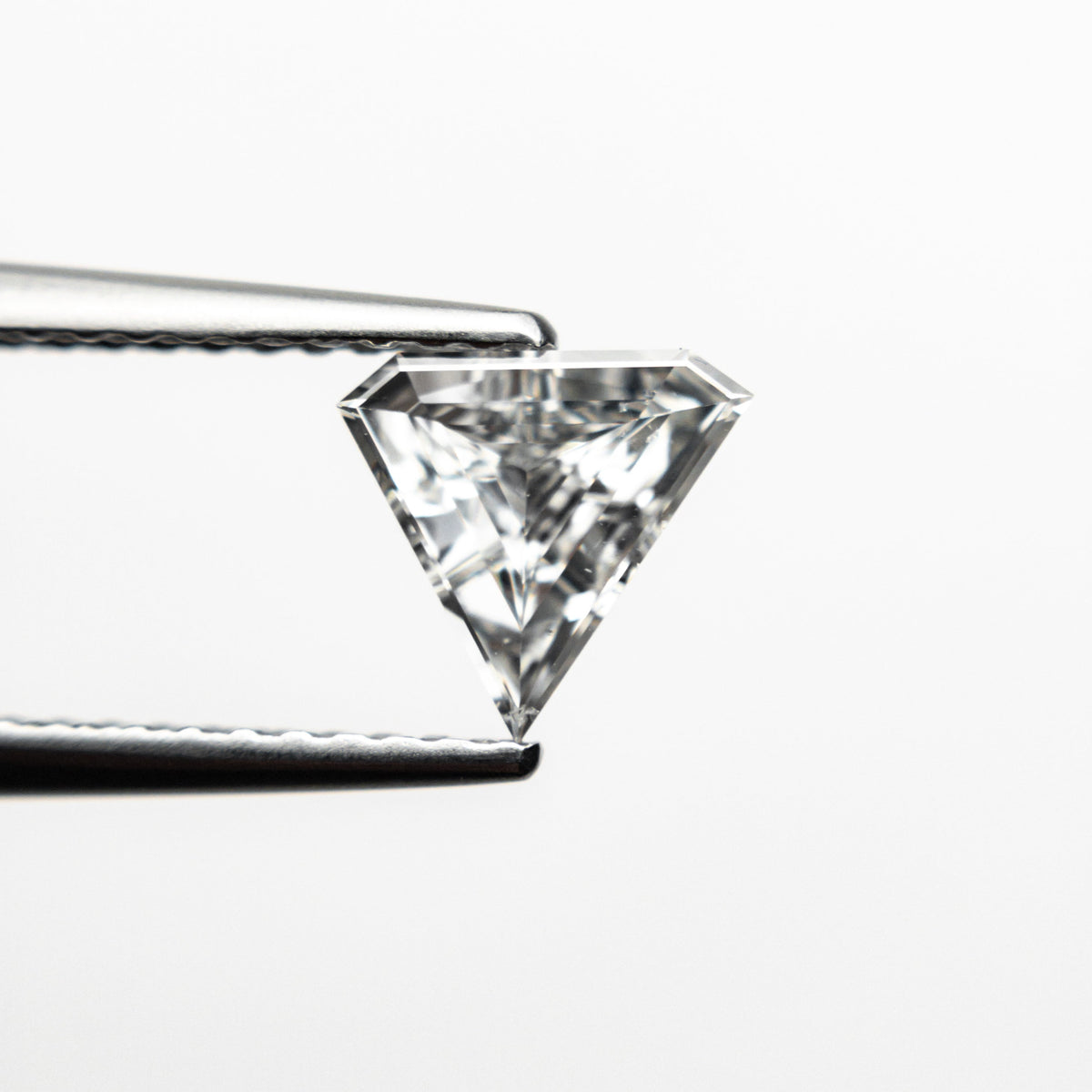The 0.42ct 6.40x6.80x2.14mm SI2 F Shield Step Cut 19677-01 by East London jeweller Rachel Boston | Discover our collections of unique and timeless engagement rings, wedding rings, and modern fine jewellery.