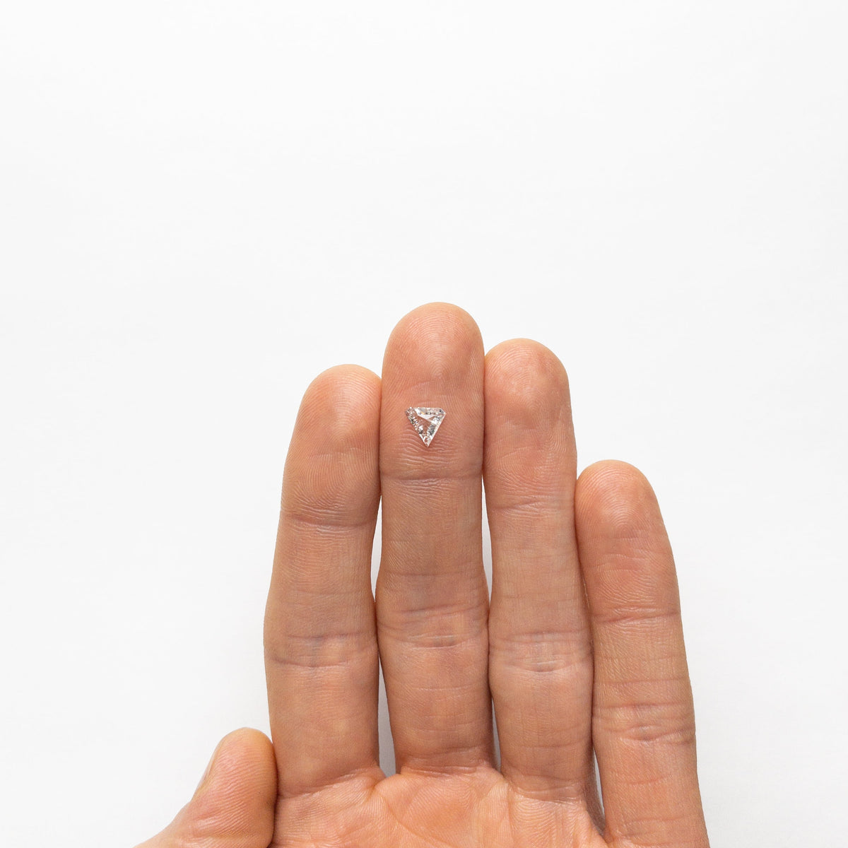 The 0.42ct 6.40x6.80x2.14mm SI2 F Shield Step Cut 19677-01 by East London jeweller Rachel Boston | Discover our collections of unique and timeless engagement rings, wedding rings, and modern fine jewellery.