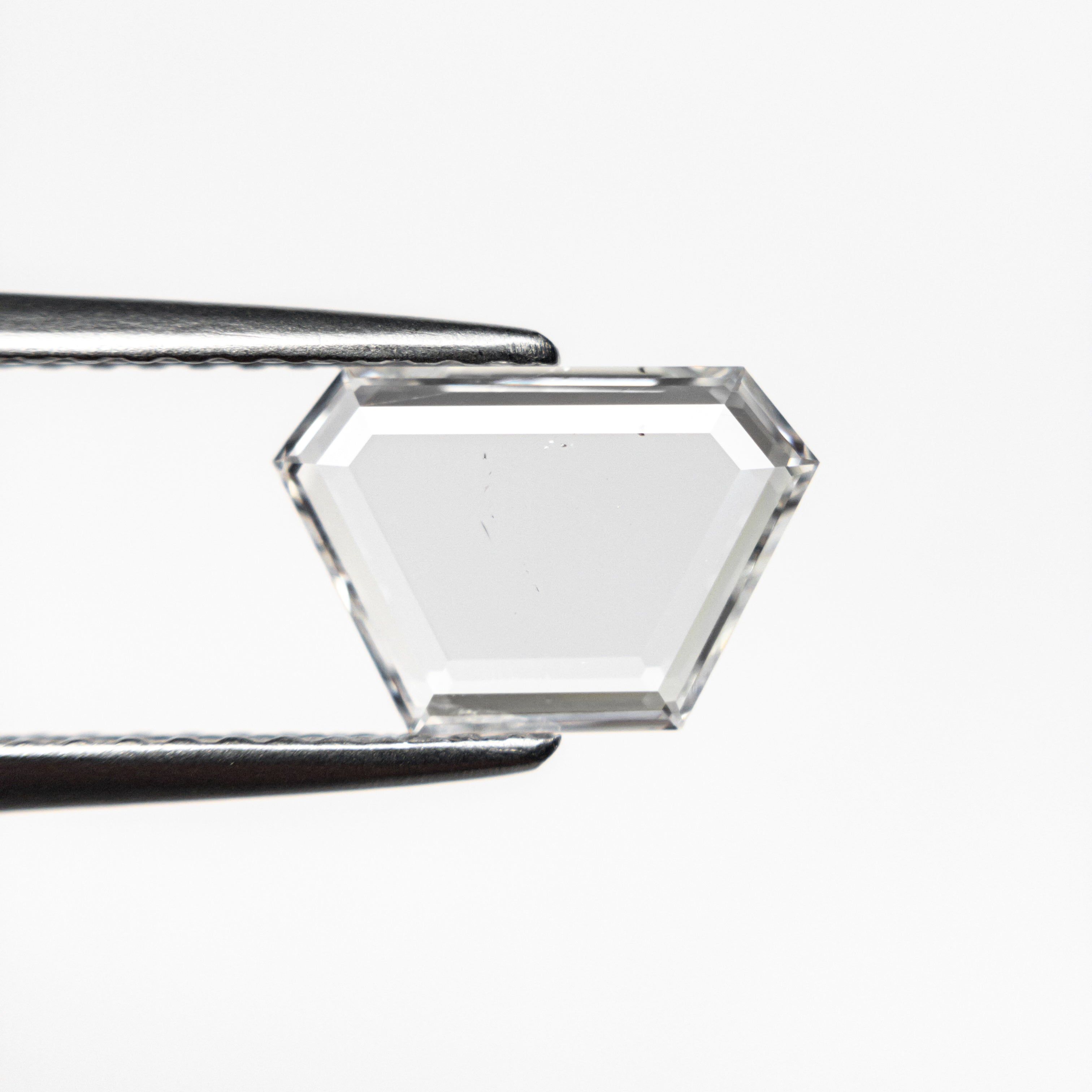 The 0.76ct 9.33x6.27x1.16mm SI2 F Trapezoid Portrait Cut 19854-26 by East London jeweller Rachel Boston | Discover our collections of unique and timeless engagement rings, wedding rings, and modern fine jewellery.