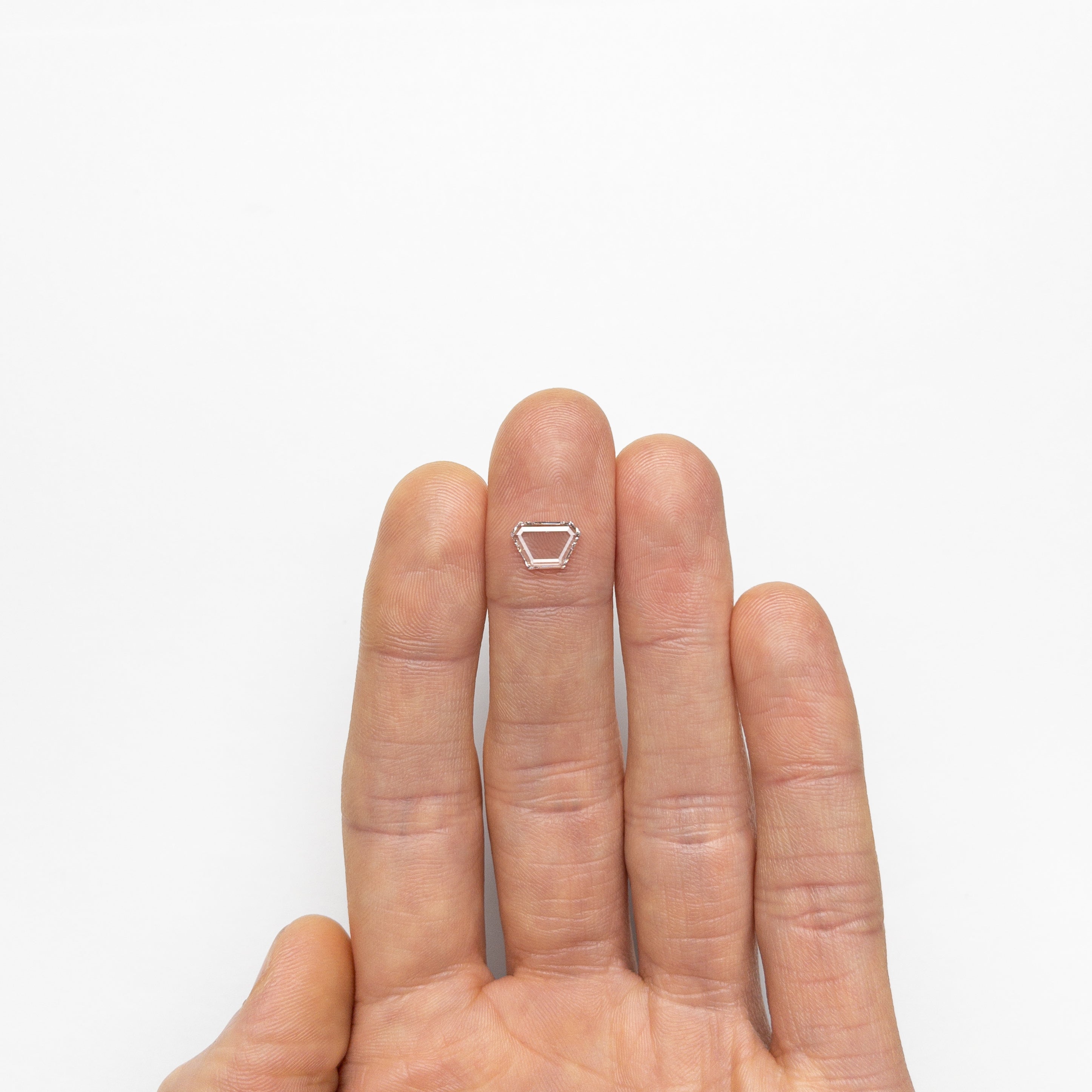 The 0.76ct 9.33x6.27x1.16mm SI2 F Trapezoid Portrait Cut 19854-26 by East London jeweller Rachel Boston | Discover our collections of unique and timeless engagement rings, wedding rings, and modern fine jewellery.