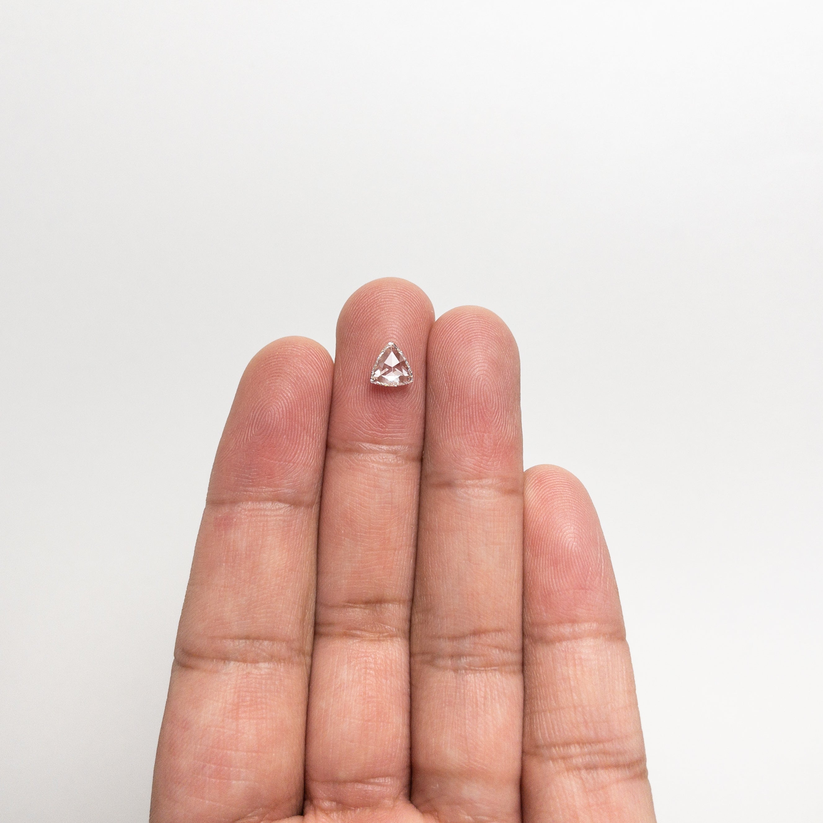 The 0.71ct 6.26x5.98x2.45mm SI1 H Trillion Rosecut 🇨🇦 21329-01 by East London jeweller Rachel Boston | Discover our collections of unique and timeless engagement rings, wedding rings, and modern fine jewellery.
