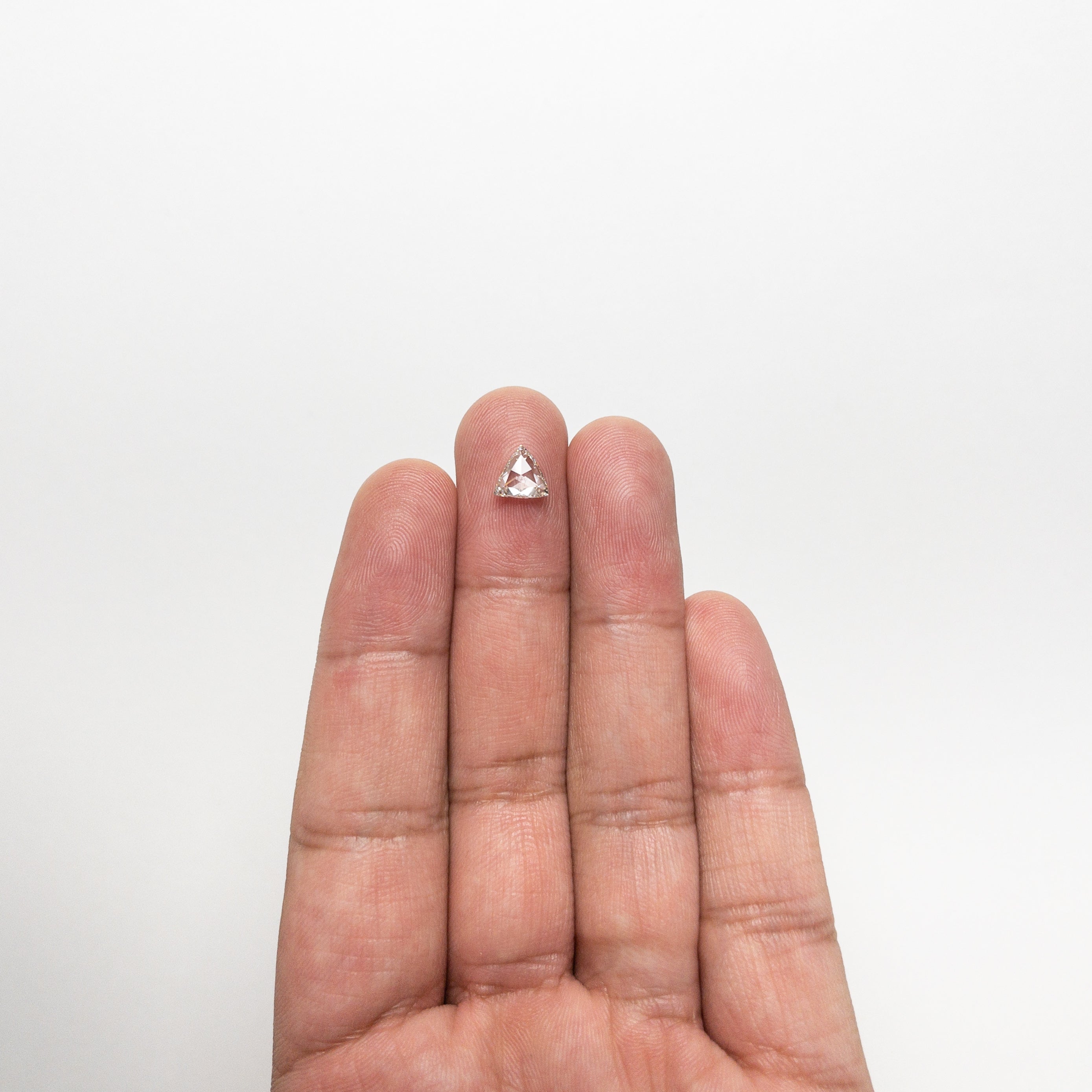 The 0.73ct 6.65x6.84x2.22mm SI1 L Trillion Rosecut 🇨🇦 21370-01 by East London jeweller Rachel Boston | Discover our collections of unique and timeless engagement rings, wedding rings, and modern fine jewellery.