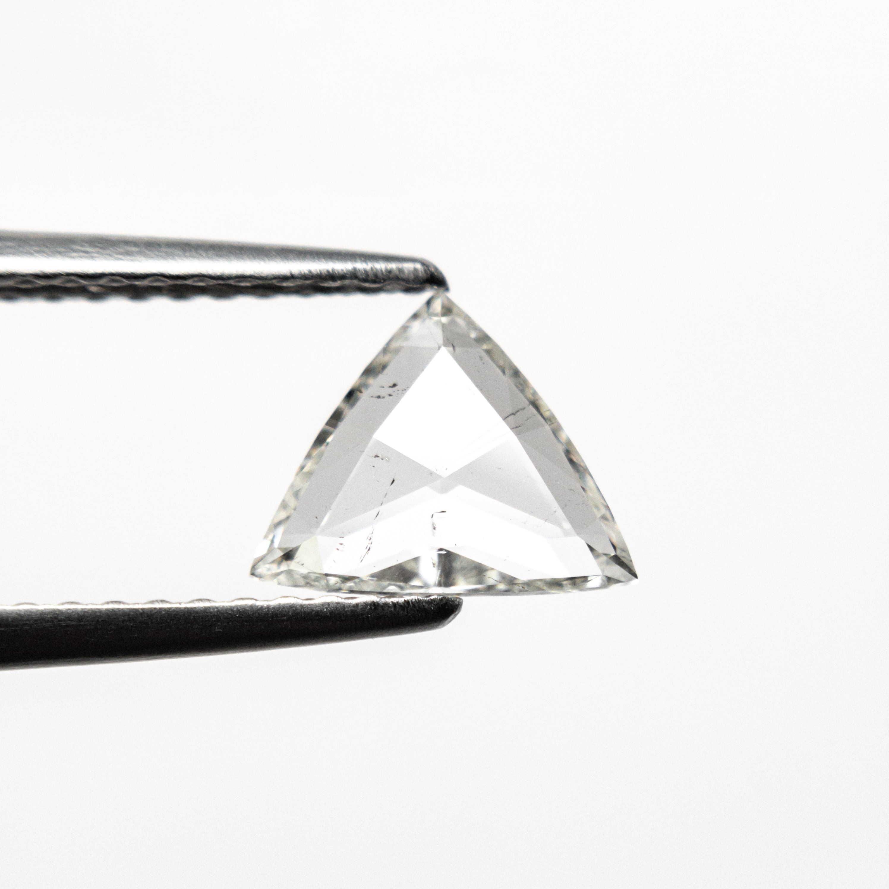 The 0.60ct 6.32x7.98x1.49mm I1 J Trillion Rosecut 🇨🇦 21442-01 by East London jeweller Rachel Boston | Discover our collections of unique and timeless engagement rings, wedding rings, and modern fine jewellery.