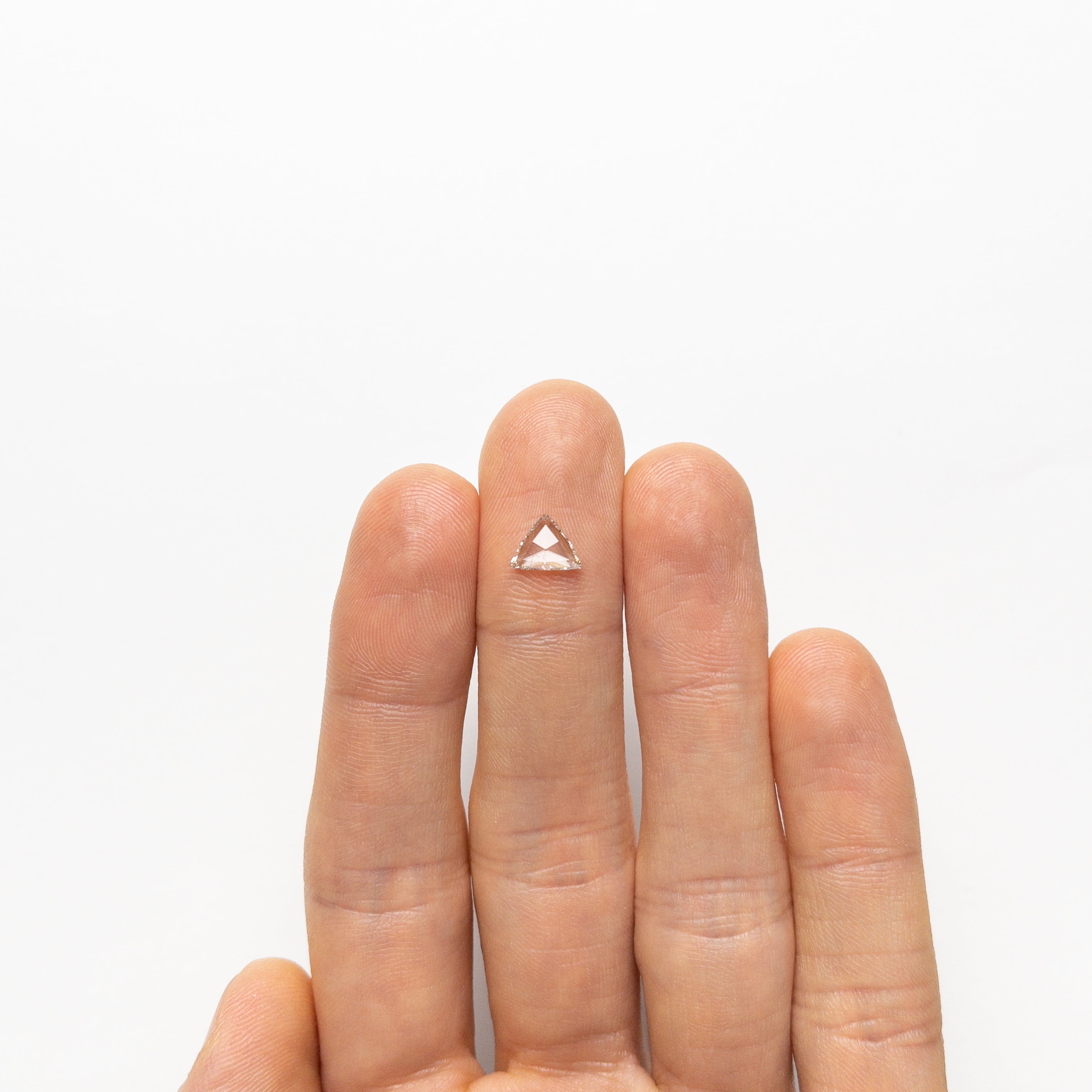 The 0.60ct 6.32x7.98x1.49mm I1 J Trillion Rosecut 🇨🇦 21442-01 by East London jeweller Rachel Boston | Discover our collections of unique and timeless engagement rings, wedding rings, and modern fine jewellery.