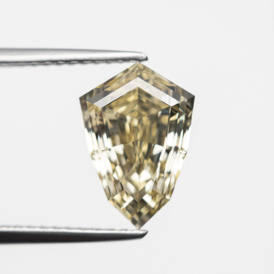 The 3.00ct 11.15x7.72x5.27mm VS1 Fancy Brownish Yellow Shield Step Cut 🇨🇦 21831-01 by East London jeweller Rachel Boston | Discover our collections of unique and timeless engagement rings, wedding rings, and modern fine jewellery. - Rachel Boston Jewellery