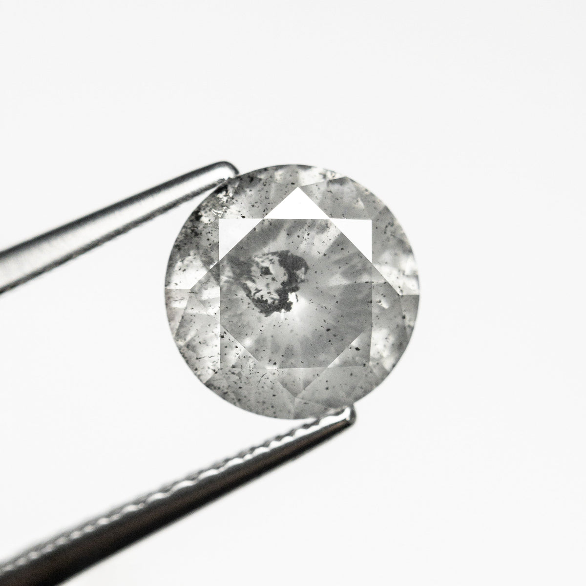 The 1.61ct 7.38x7.34x4.53mm Round Brilliant 21876-07 by East London jeweller Rachel Boston | Discover our collections of unique and timeless engagement rings, wedding rings, and modern fine jewellery.