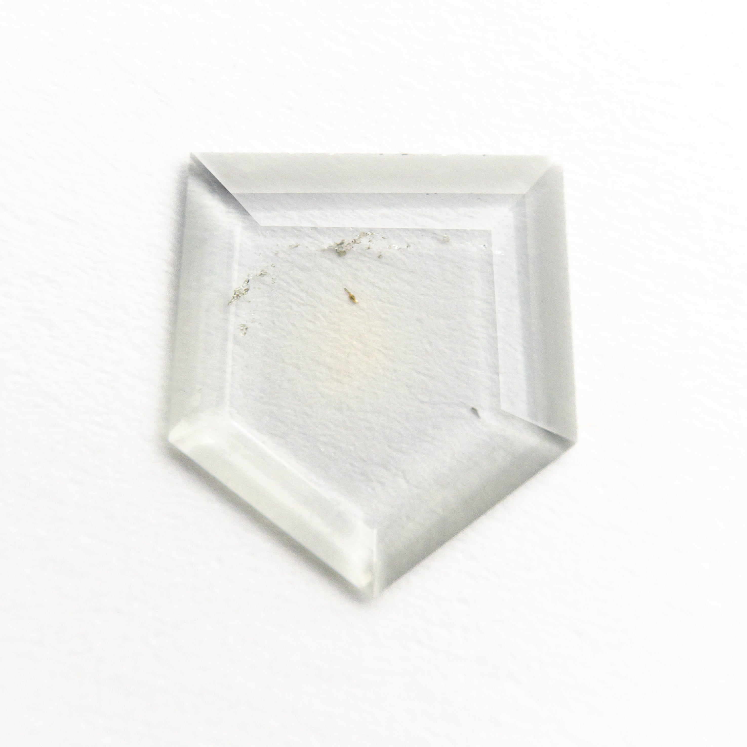 The 1.00ct 9.65x8.90x0.99mm Shield Portrait Cut Sapphire 22392-01 by East London jeweller Rachel Boston | Discover our collections of unique and timeless engagement rings, wedding rings, and modern fine jewellery.