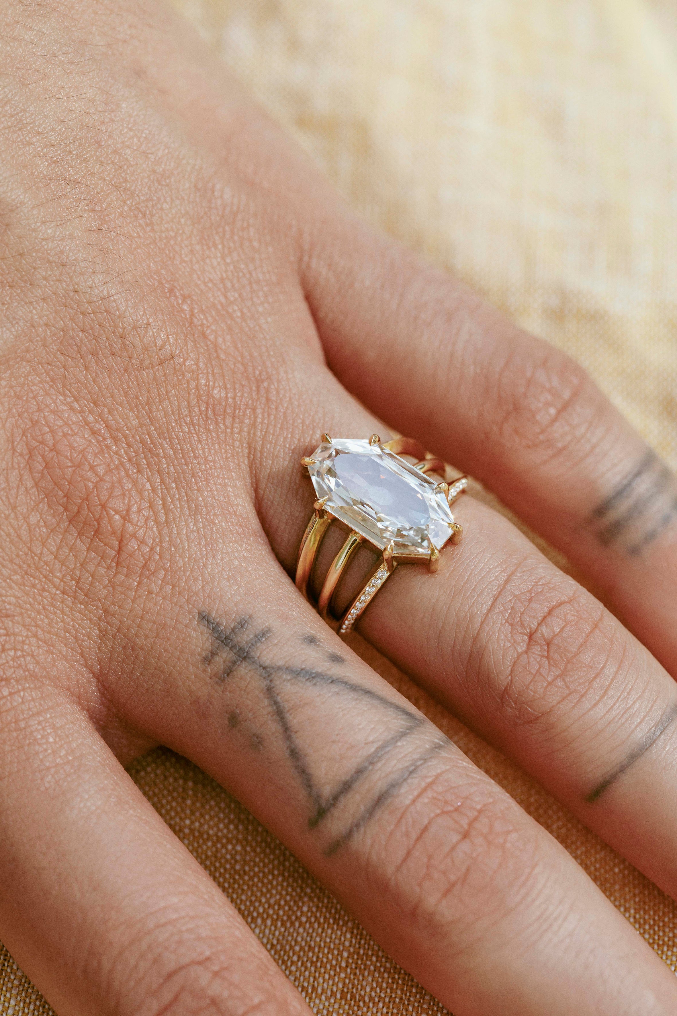 The X - Cupid Ring by East London jeweller Rachel Boston | Discover our collections of unique and timeless engagement rings, wedding rings, and modern fine jewellery.