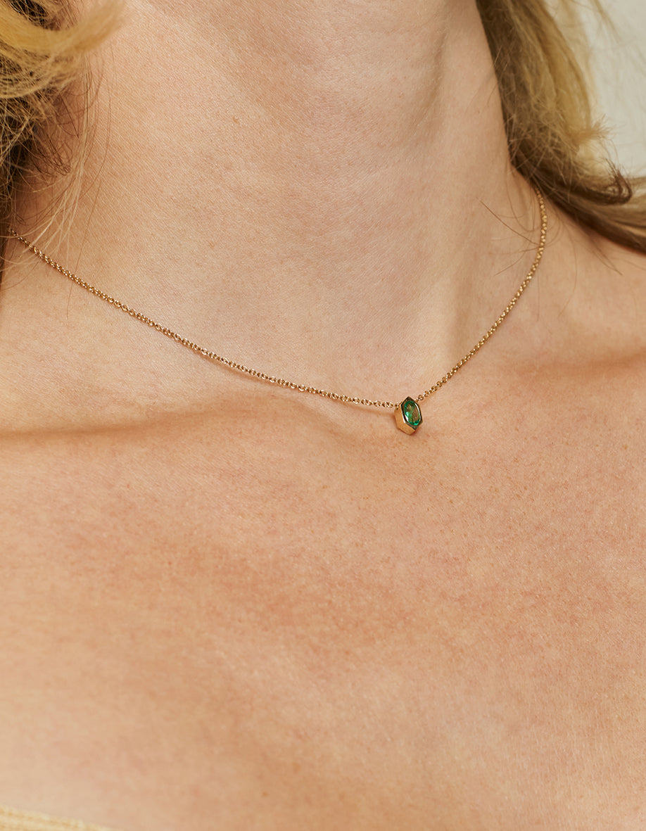The Oval Emerald Hexagon Necklace by East London jeweller Rachel Boston | Discover our collections of unique and timeless engagement rings, wedding rings, and modern fine jewellery.