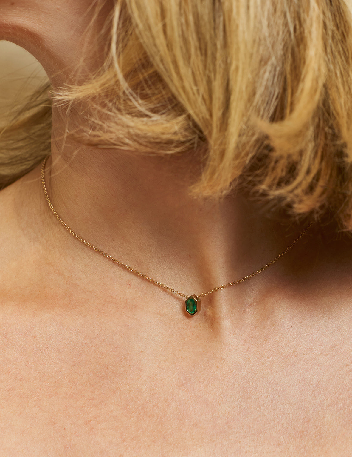 The Oval Emerald Hexagon Necklace by East London jeweller Rachel Boston | Discover our collections of unique and timeless engagement rings, wedding rings, and modern fine jewellery.