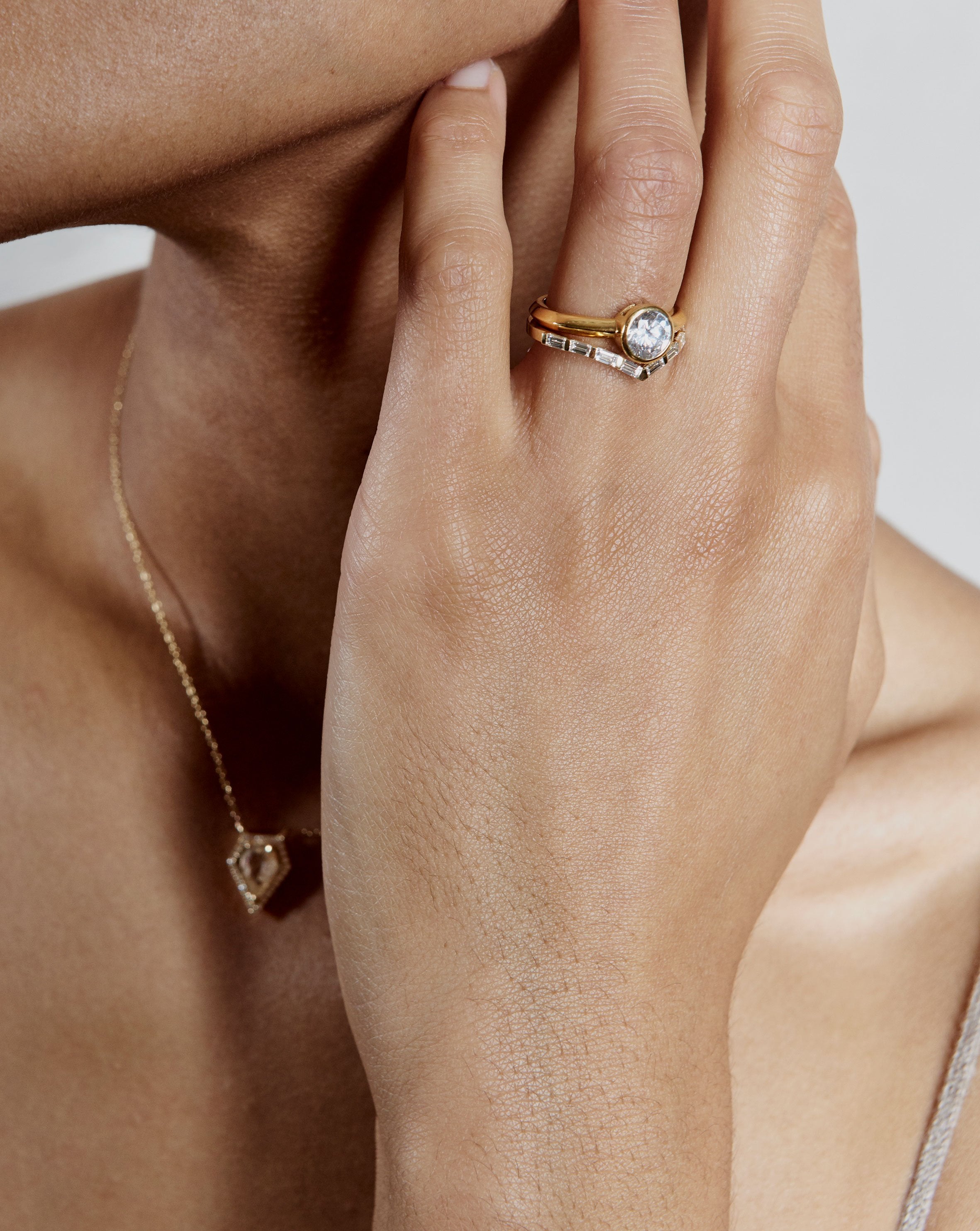 The Baguette Diamond V Shape Wedding Band by East London jeweller Rachel Boston | Discover our collections of unique and timeless engagement rings, wedding rings, and modern fine jewellery.