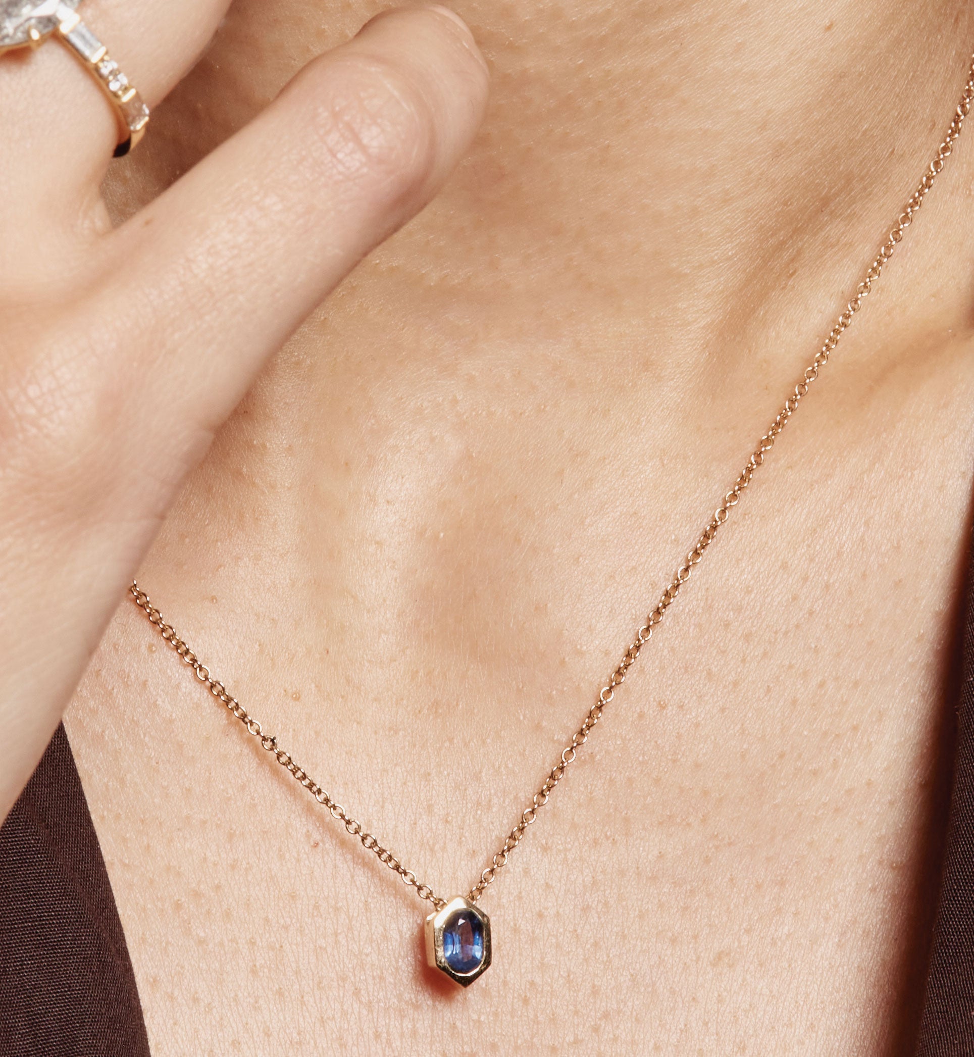 The Oval Sapphire Hexagon Necklace by East London jeweller Rachel Boston | Discover our collections of unique and timeless engagement rings, wedding rings, and modern fine jewellery.