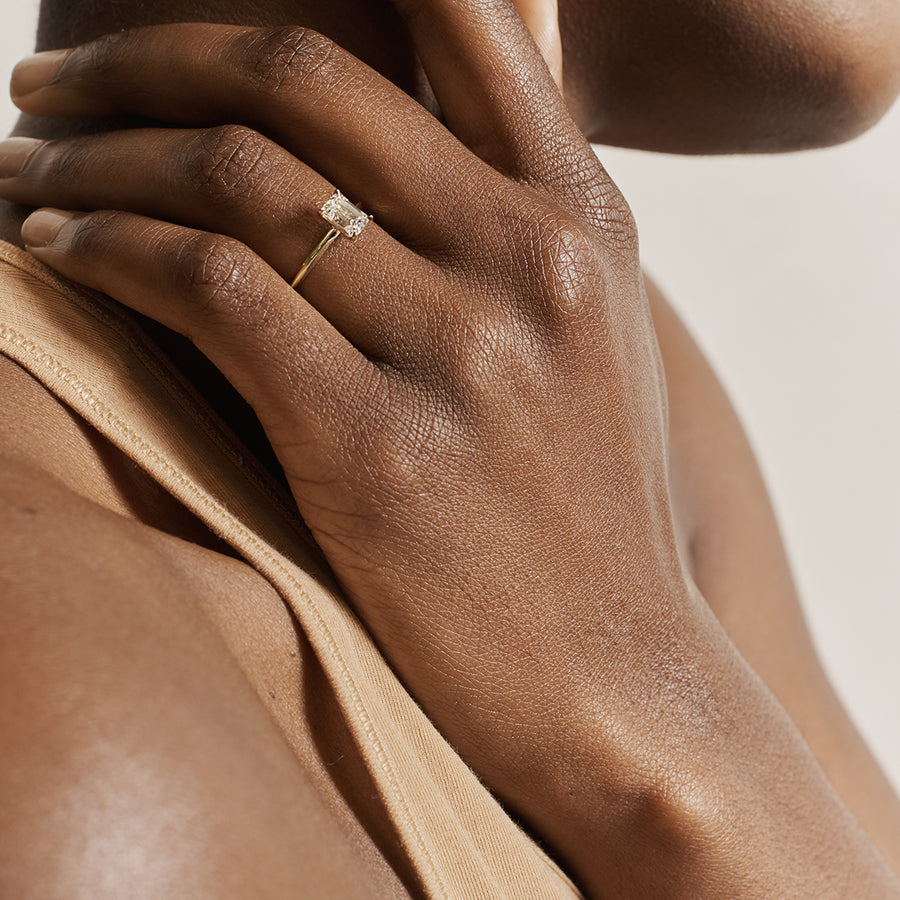 The Grace Ring - Emerald Cut by East London jeweller Rachel Boston | Discover our collections of unique and timeless engagement rings, wedding rings, and modern fine jewellery. - Rachel Boston Jewellery